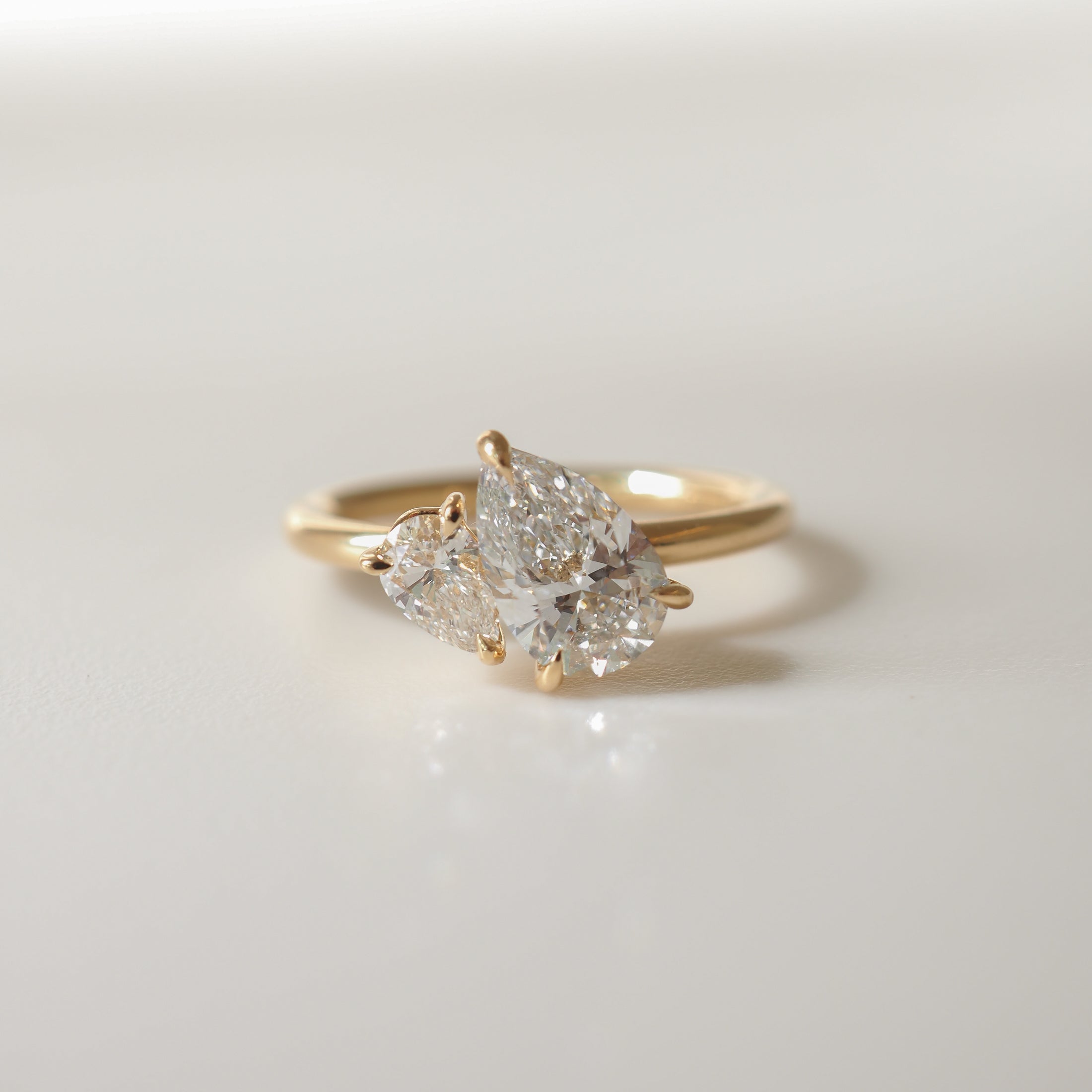 Pear cut moissanite two-stone engagement ring in white gold setting, 1.0-3.0 carats