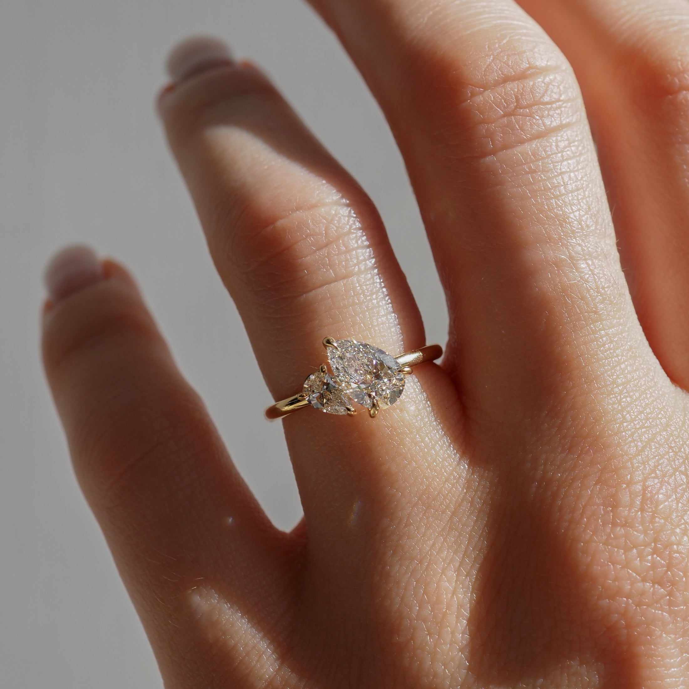 Pear cut moissanite two-stone engagement ring in white gold setting, 1.0-3.0 carats