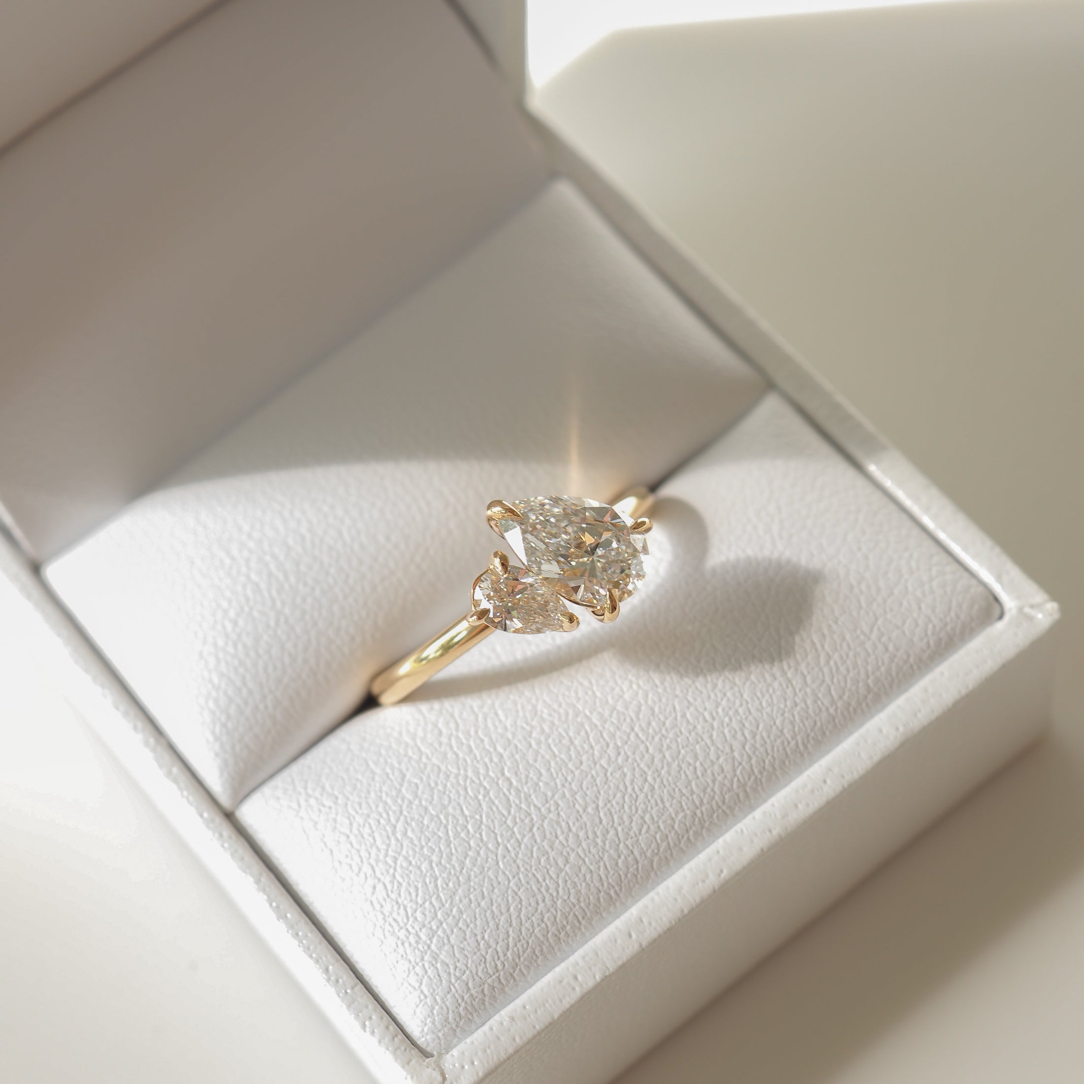 Pear cut moissanite two-stone engagement ring in white gold setting, 1.0-3.0 carats