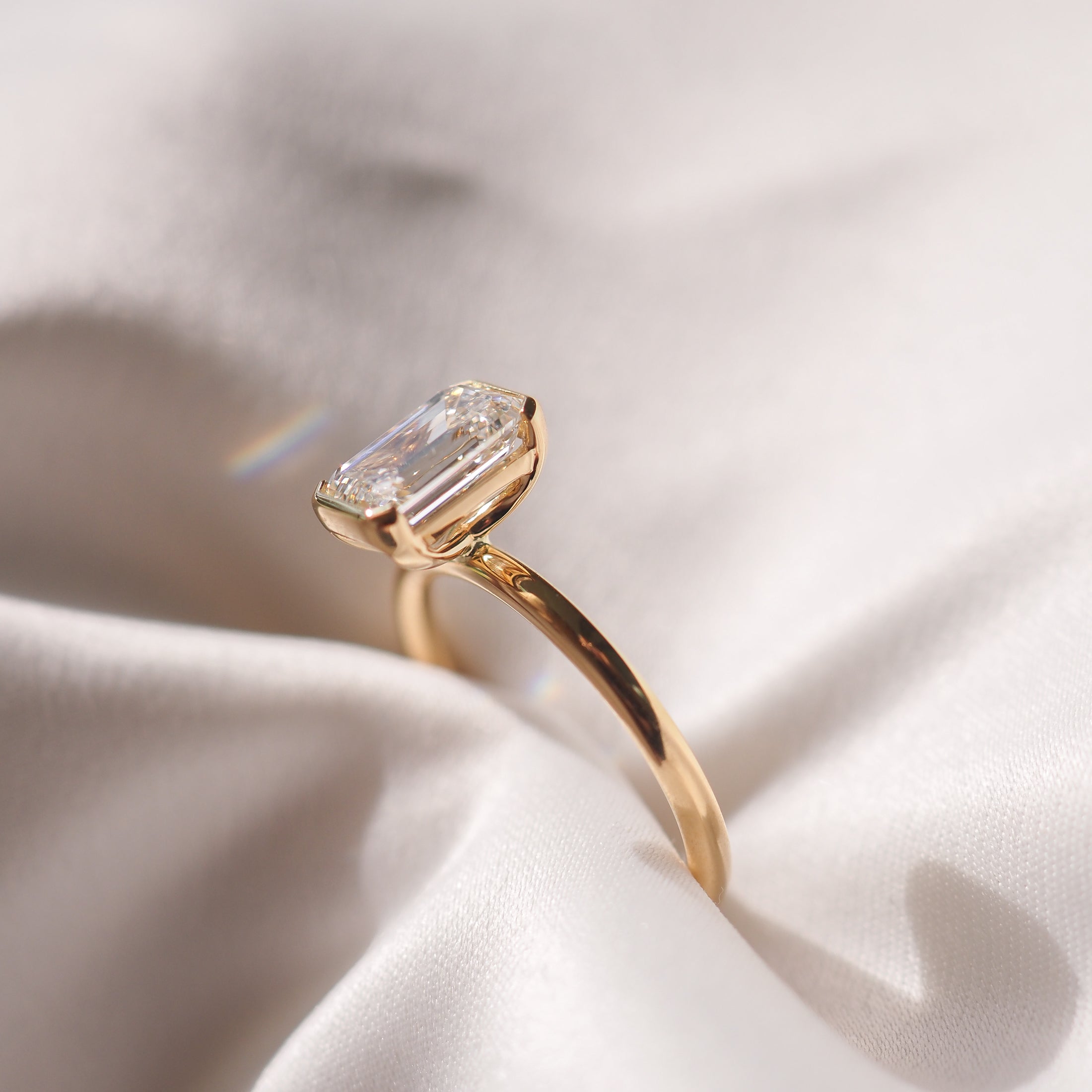 Emerald cut moissanite bezel solitaire engagement ring in platinum setting, 1.50-2.50 CT