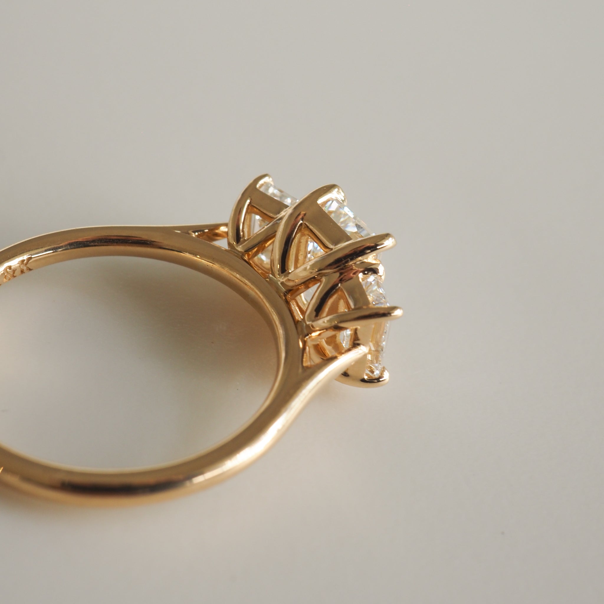 2.05 carat emerald cut moissanite three-stone engagement ring in white gold setting