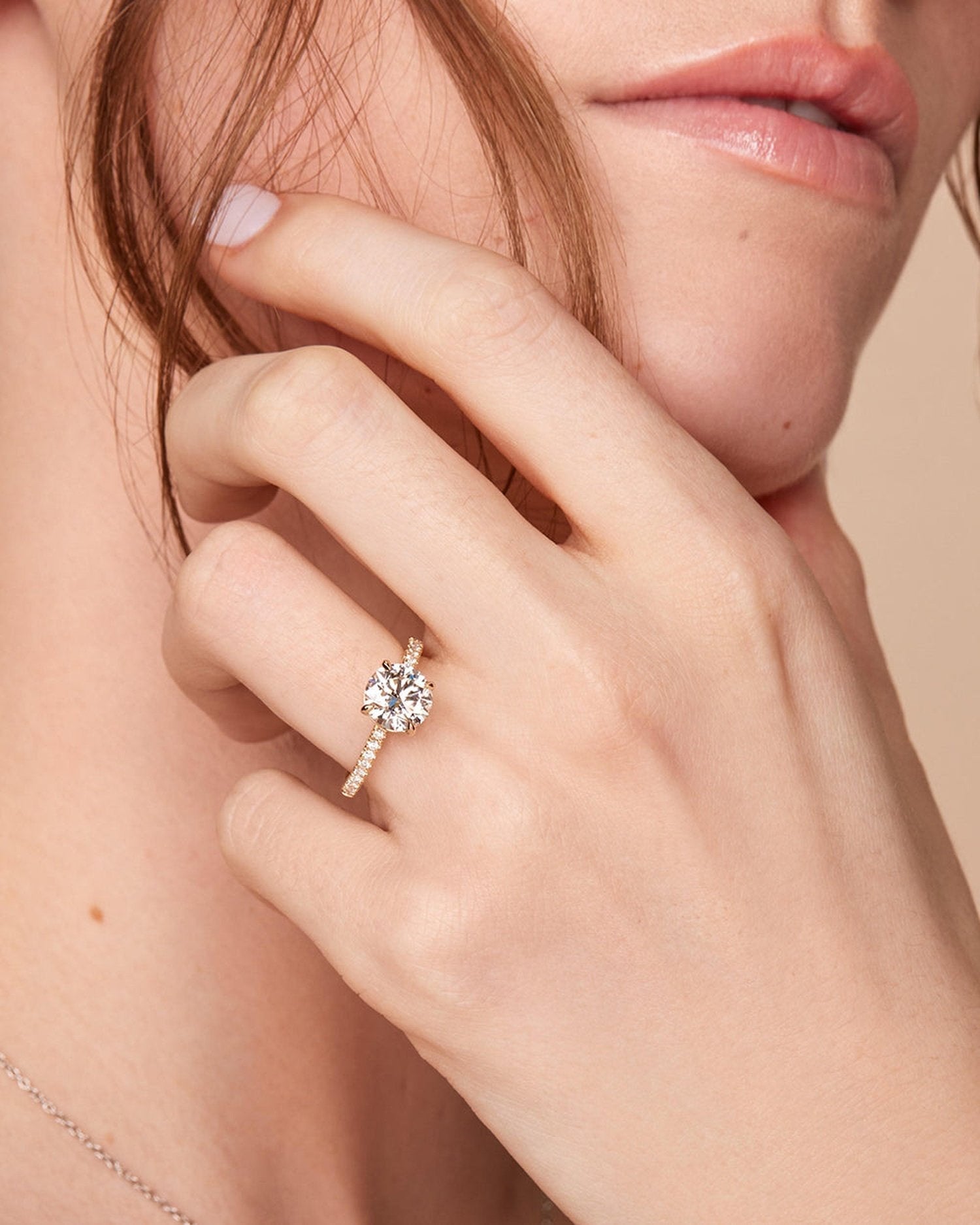 1.5–3.5 CT round cut lab grown diamond engagement ring in gold, accented with pave diamonds along the band for a refined, radiant look