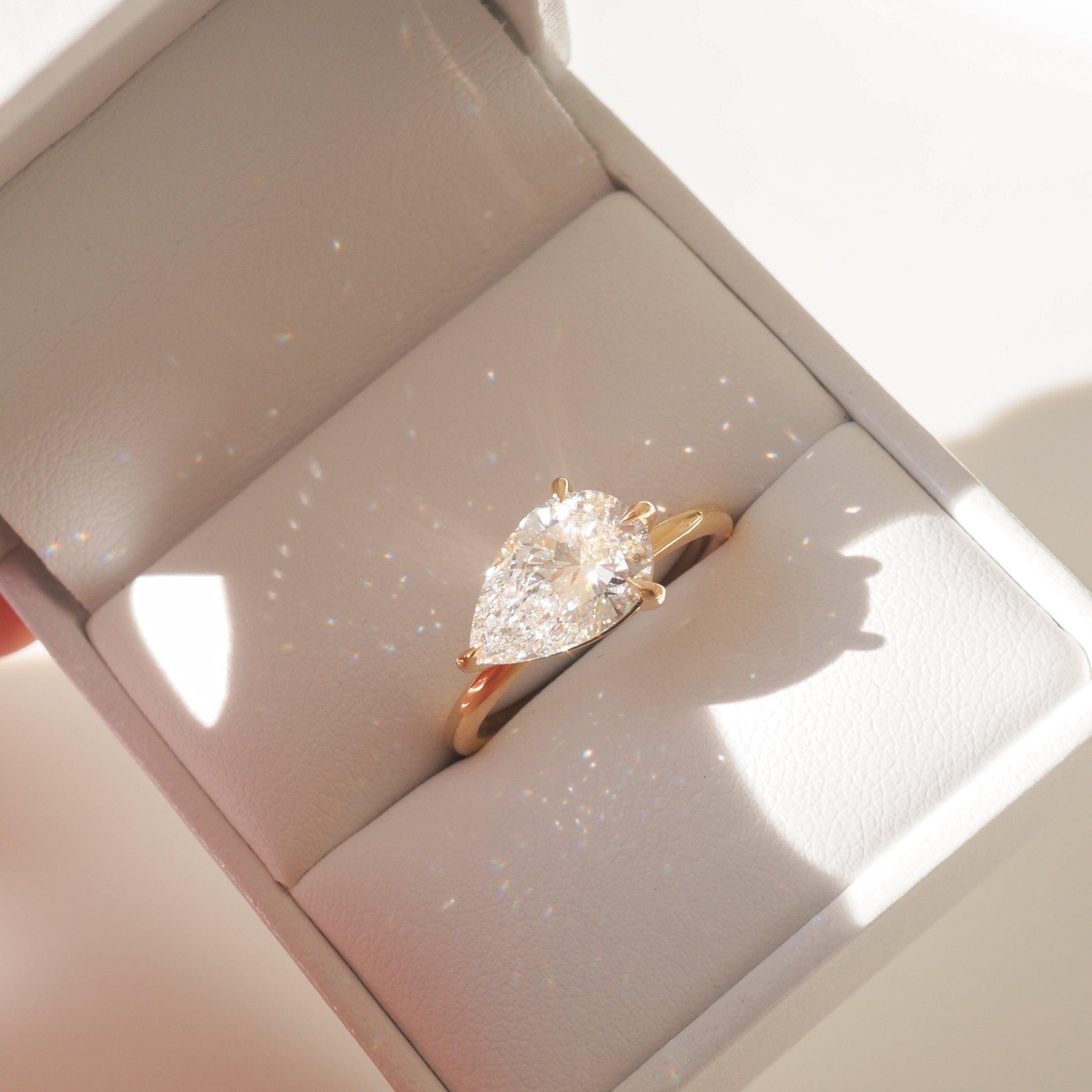 East-west pear shaped moissanite solitaire engagement ring in platinum setting, 2.0-4.0 carats