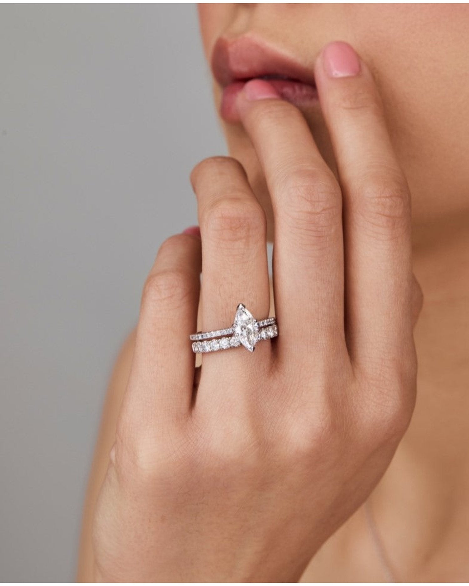 1.0–3.0 CT marquise cut lab grown diamond engagement ring in gold, featuring a slim pave band and a sharp, elongated center stone