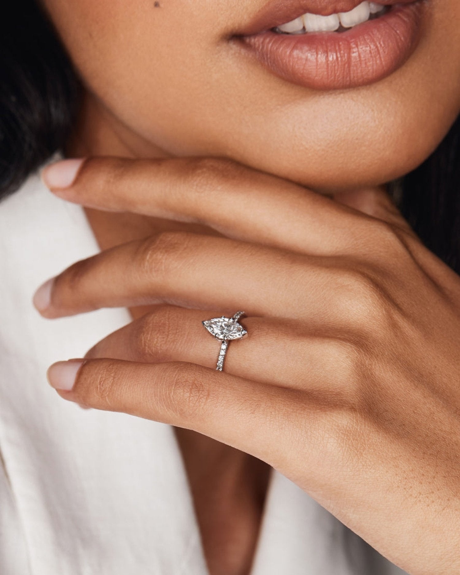 1.0–3.0 CT marquise cut lab grown diamond engagement ring in gold, featuring a slim pave band and a sharp, elongated center stone