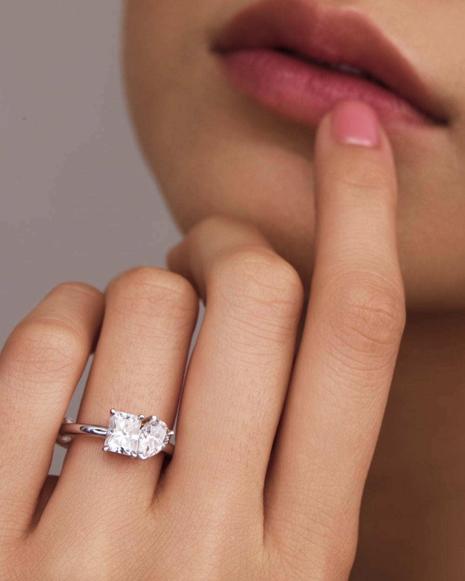 3.20 TCW lab grown diamond two stone engagement ring with radiant and pear cuts in gold, modern Toi et Moi style with elegant contrast