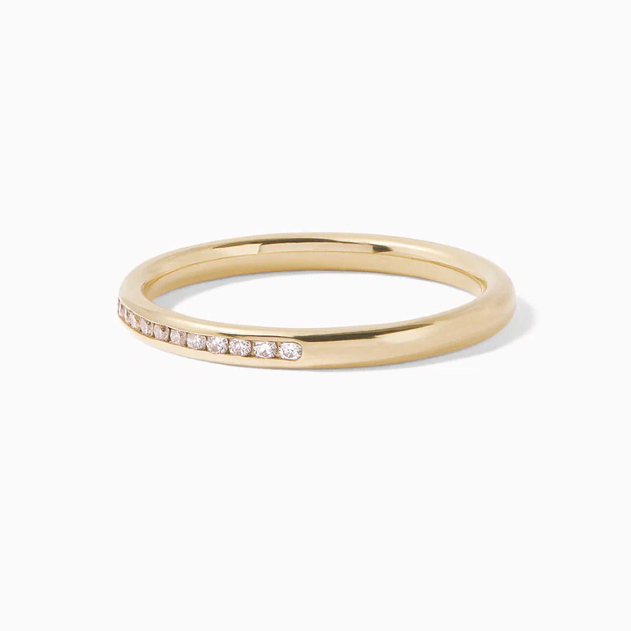 0.35 TCW round cut diamond curved wedding band featuring CVD lab grown diamonds and a sleek gold design.