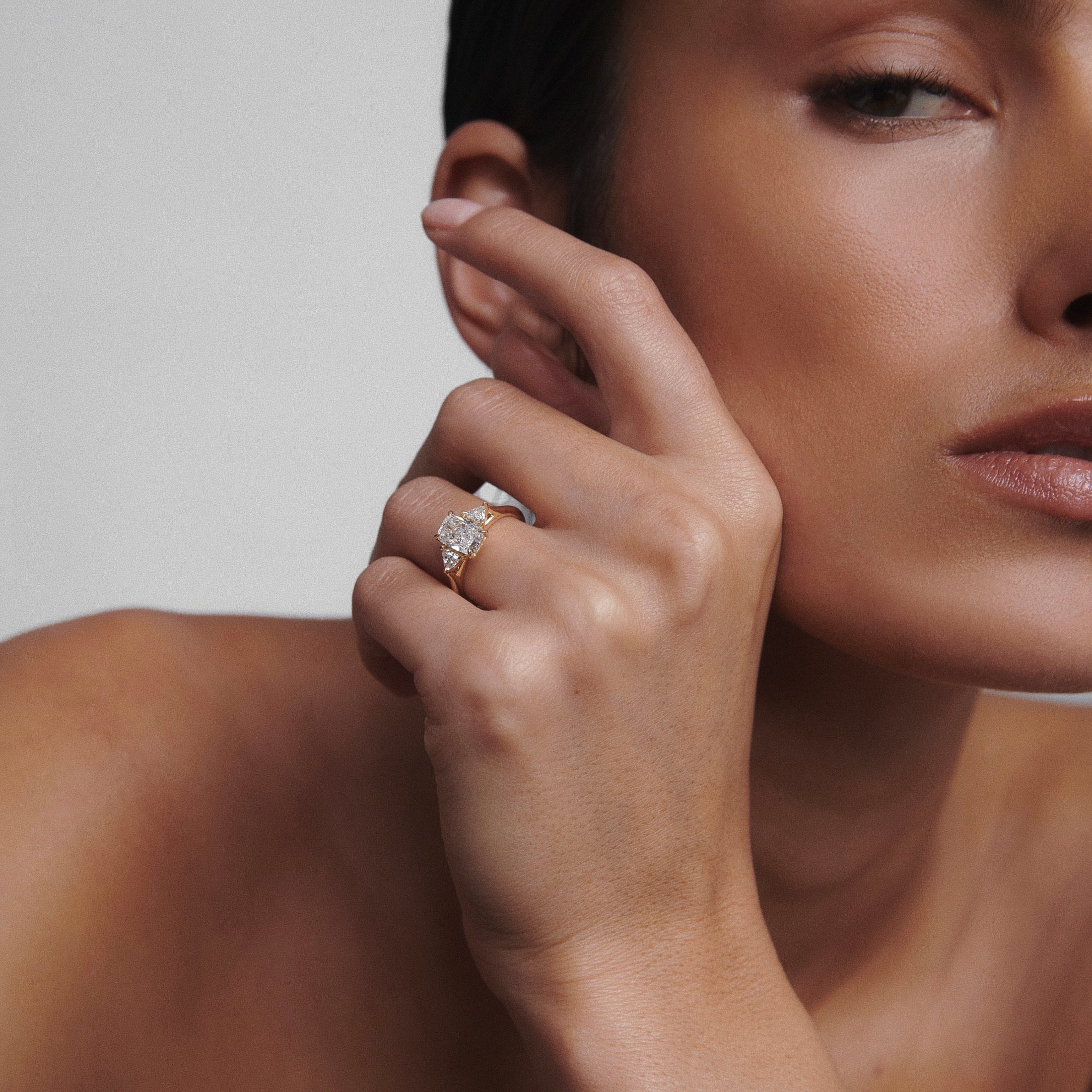 Cushion cut moissanite three-stone engagement ring in white gold setting, 1.40-2.50 CT