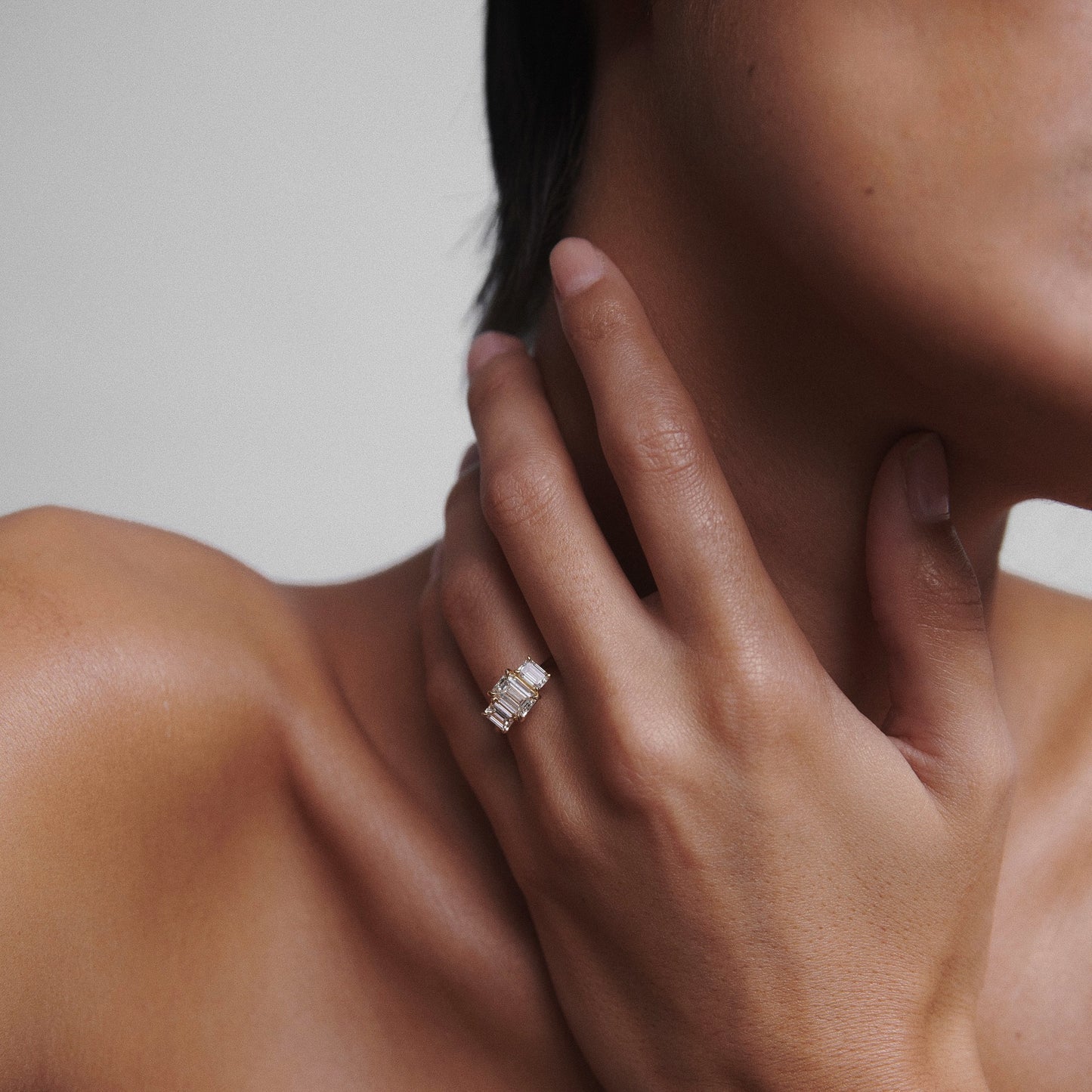 2.05 carat emerald cut moissanite three-stone engagement ring in white gold setting