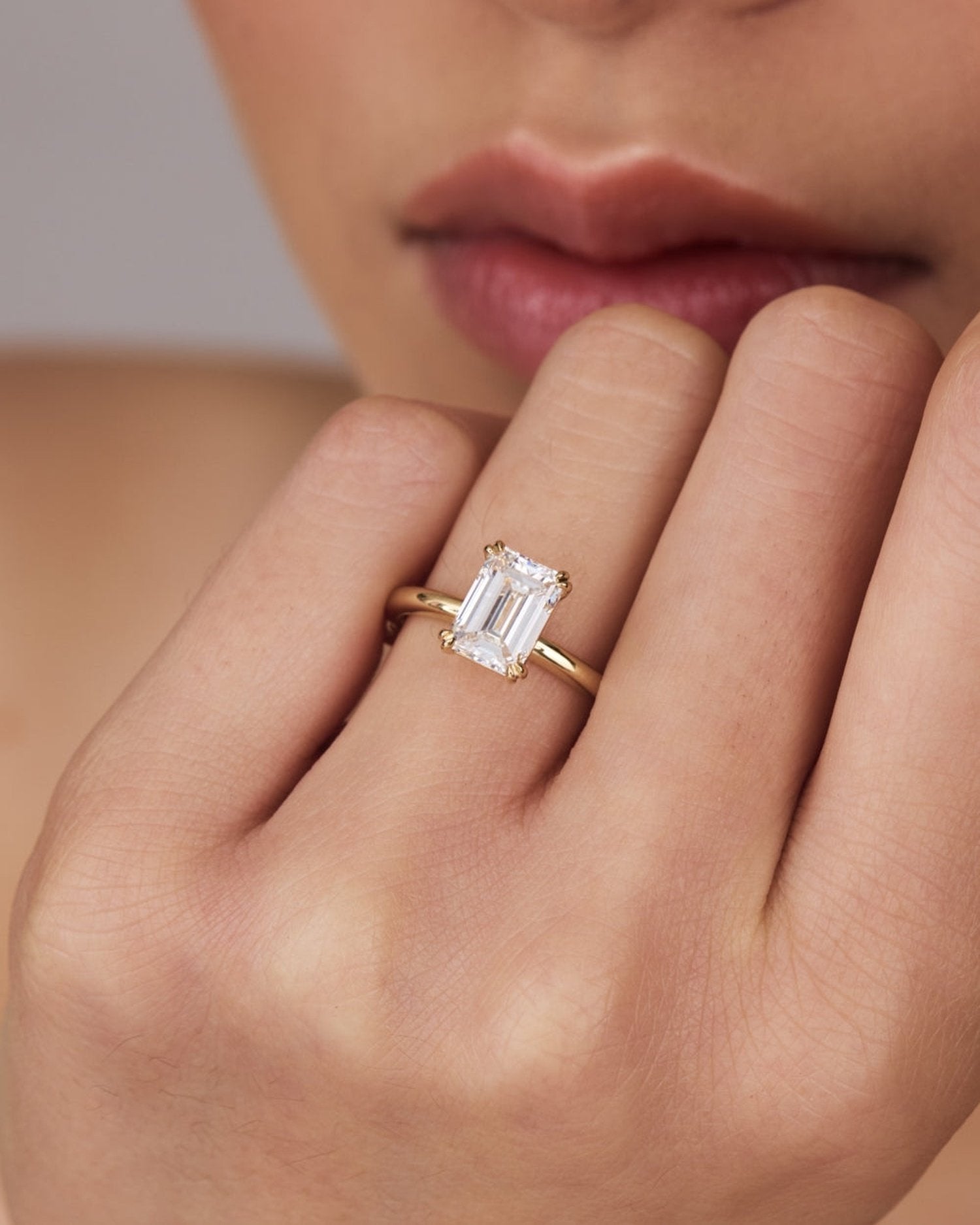 1.0–3.0 CT emerald cut lab grown diamond solitaire engagement ring in gold, showcasing a sleek, step-cut center stone