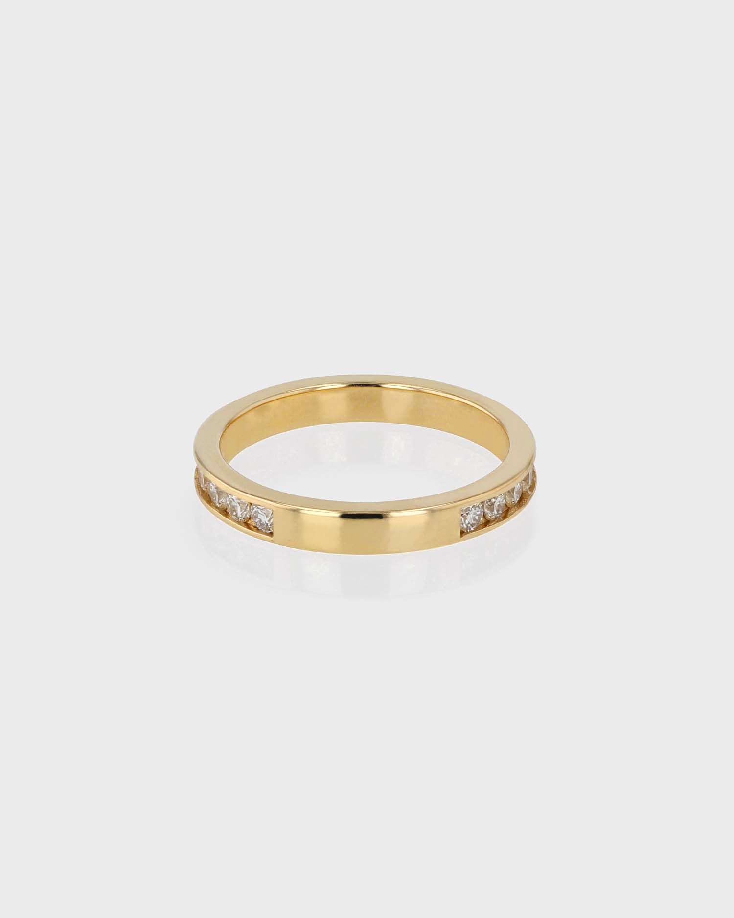0.70 TCW Round Diamond Channel Wedding Band