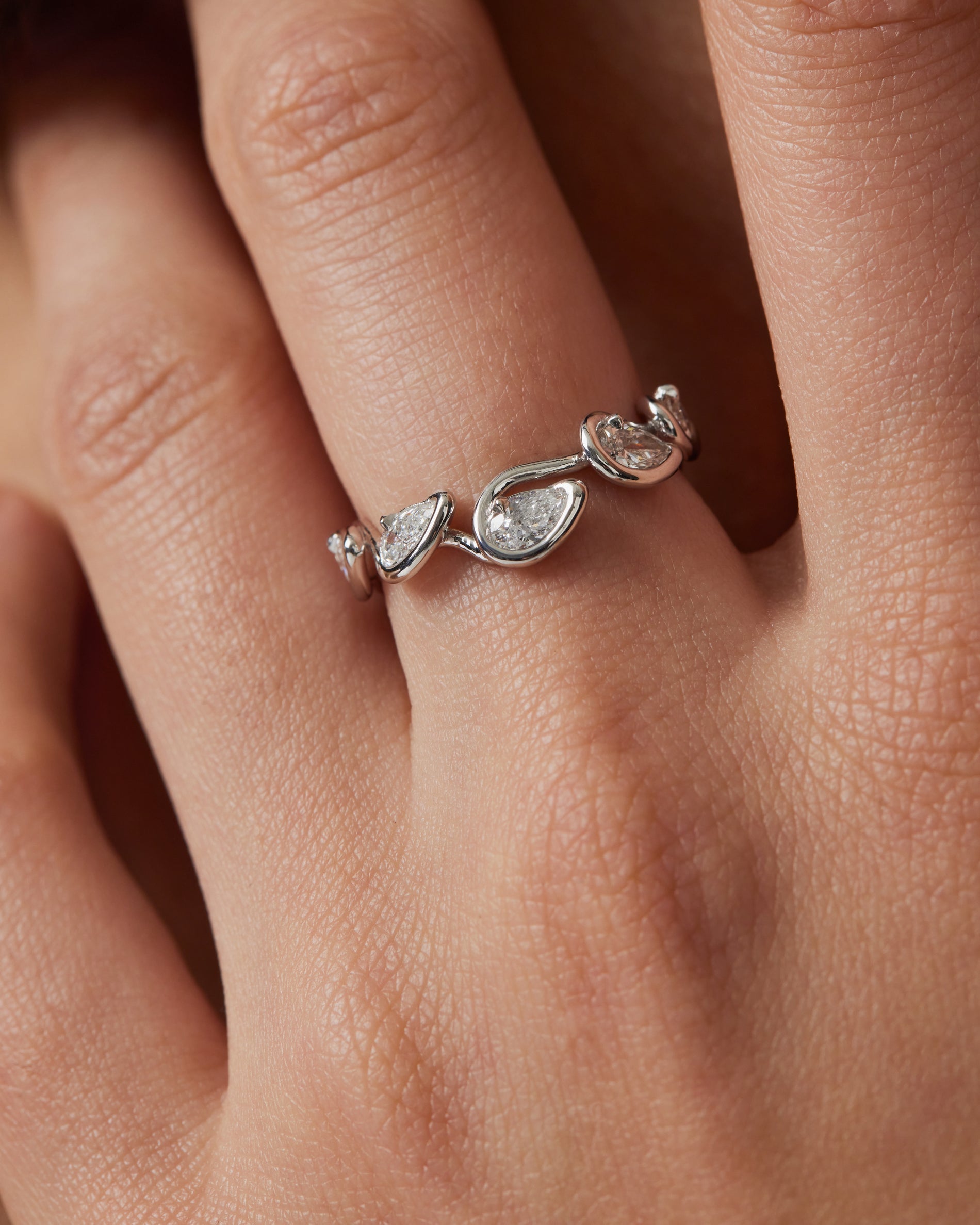 0.10 TCW Pear EF-VVS Diamond bezel Wedding Band
