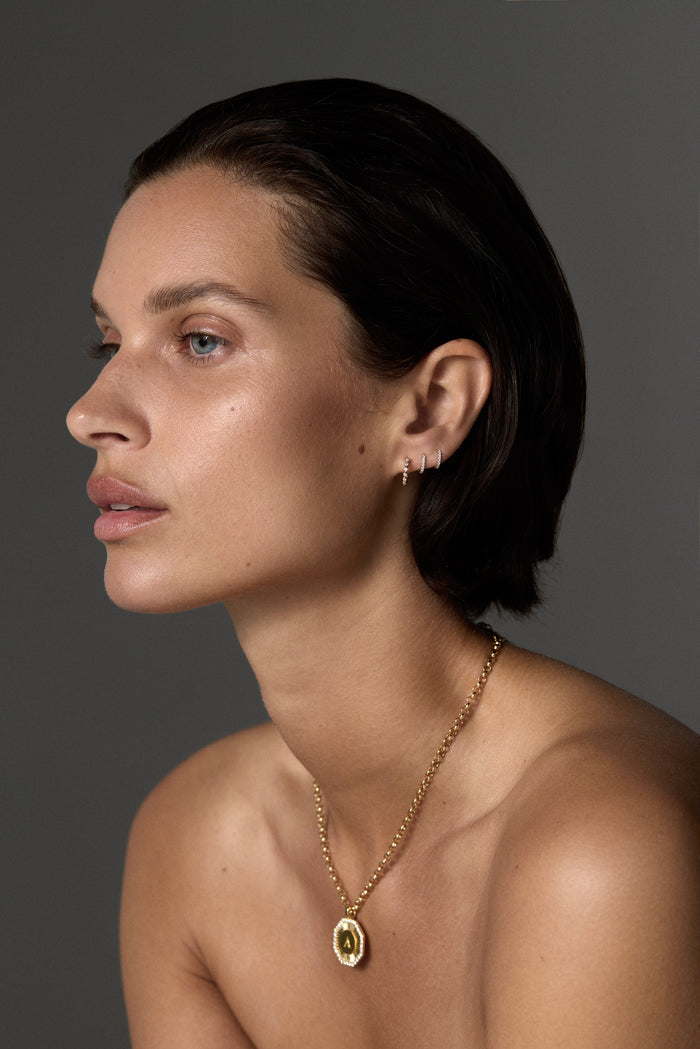 0.05 TCW Round Cut Moissanite Diamond Bezel Huggies Earrings