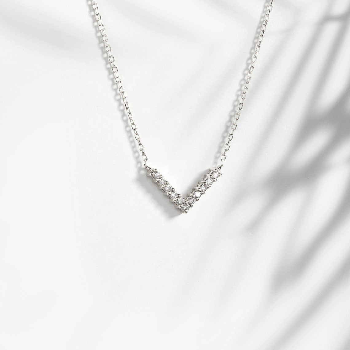 0.10 TCW Round Moissanite Diamond V Shaped Necklace - Camila Brown