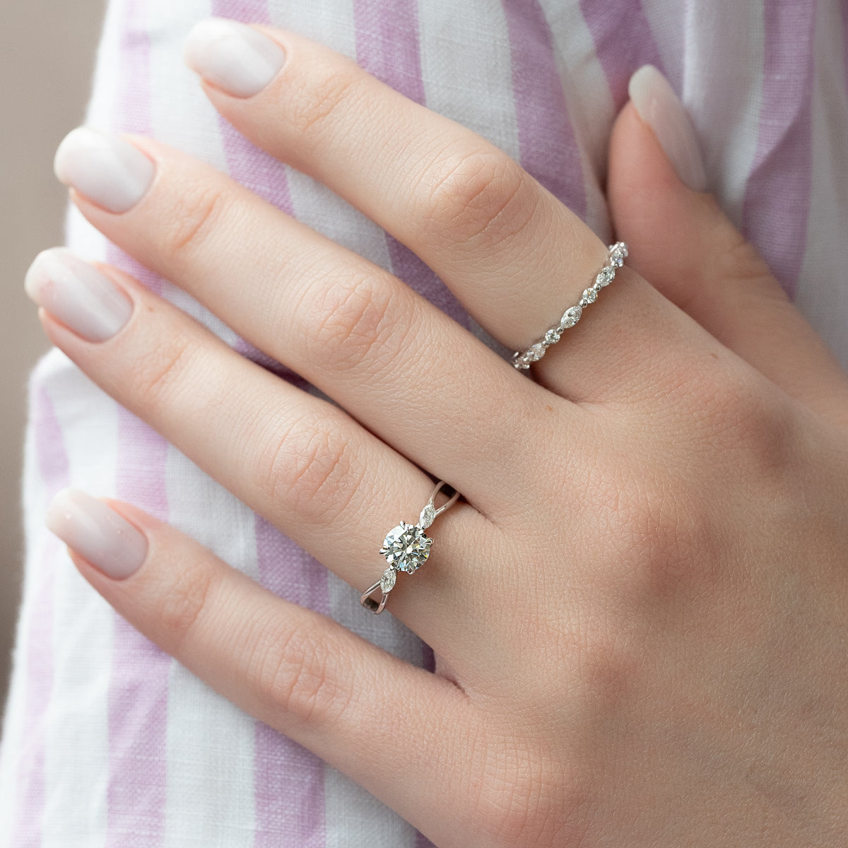 Round cut CVD diamond three stone engagement ring in white gold setting