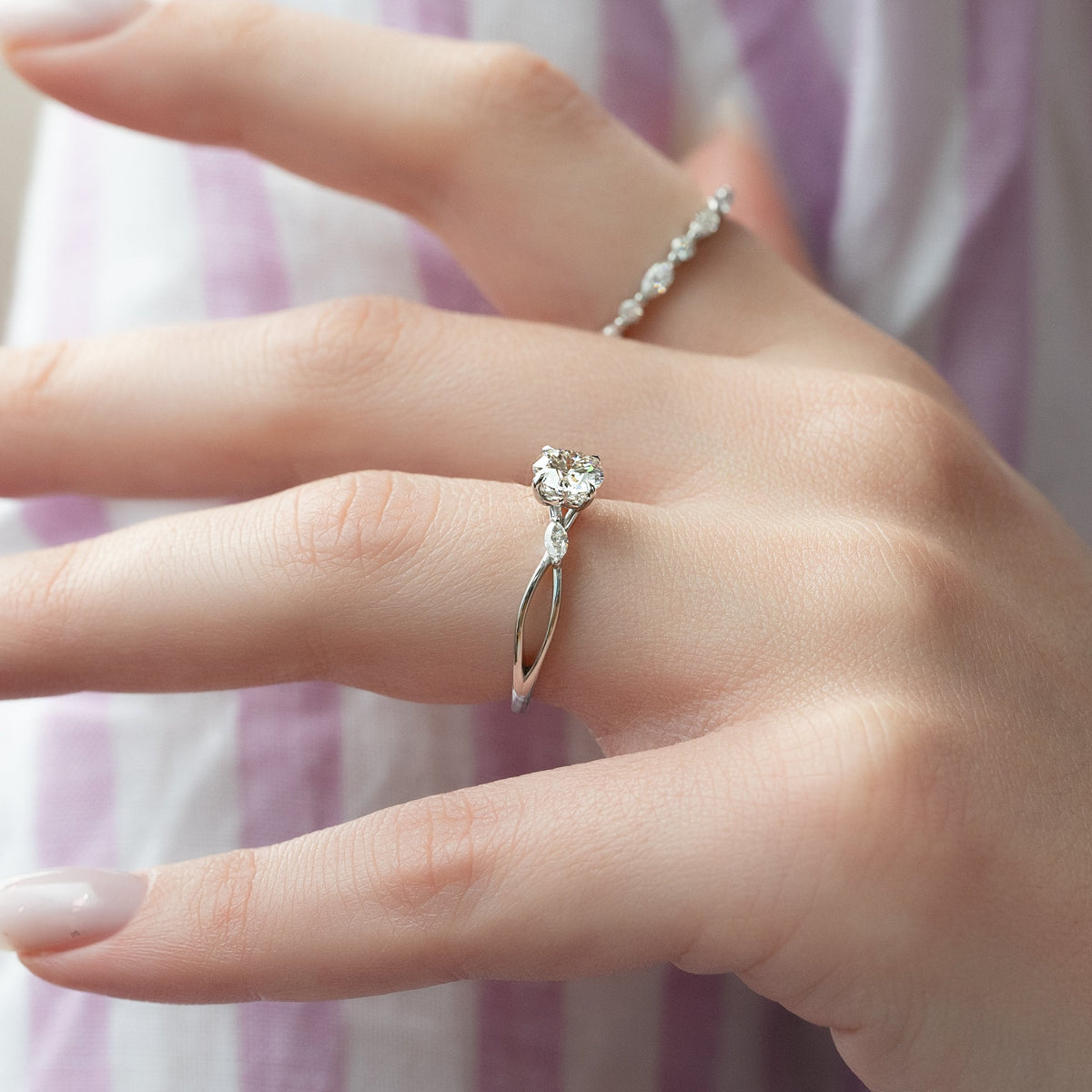 Round cut CVD diamond three stone engagement ring in white gold setting