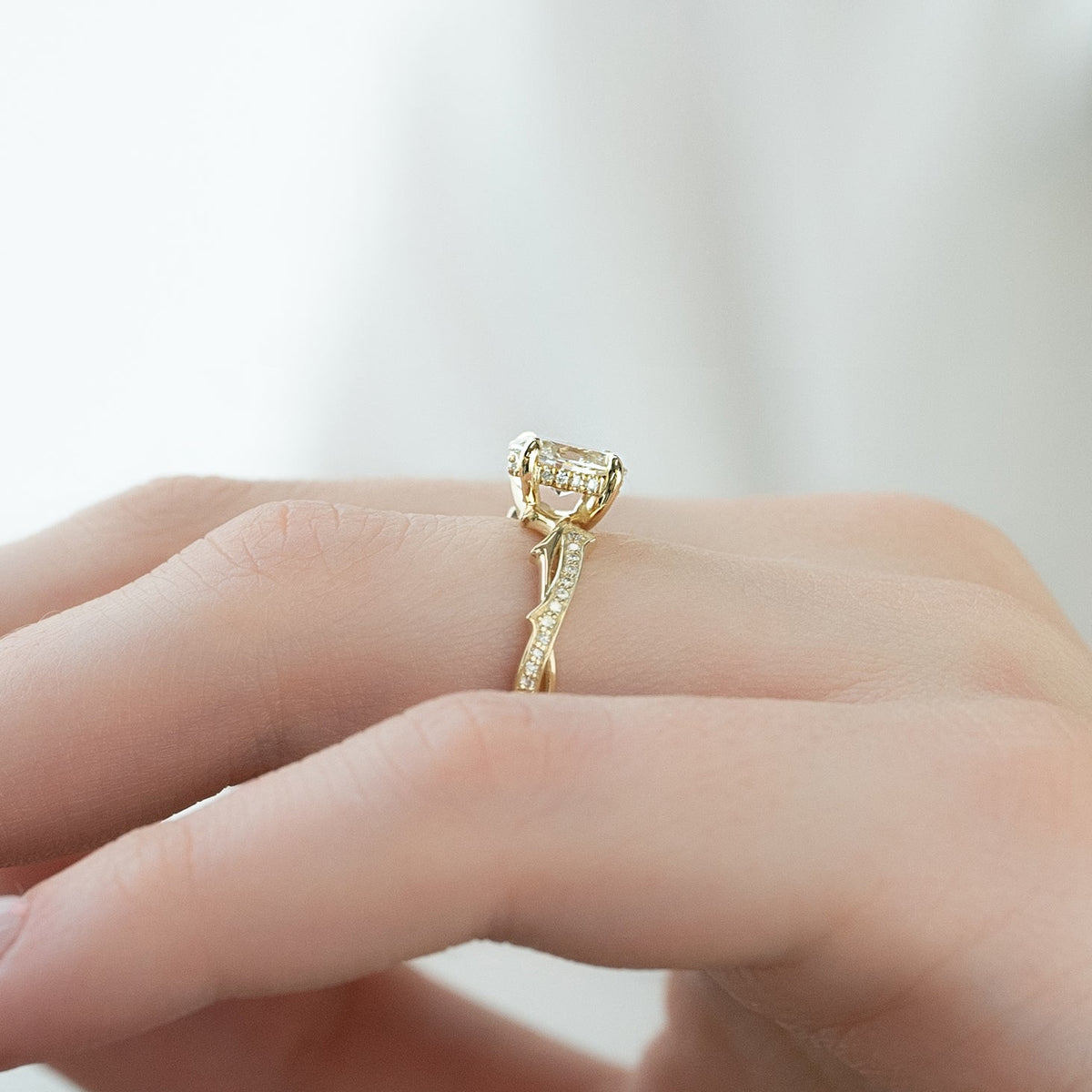 Oval cut CVD diamond engagement ring with twig-inspired band in platinum setting