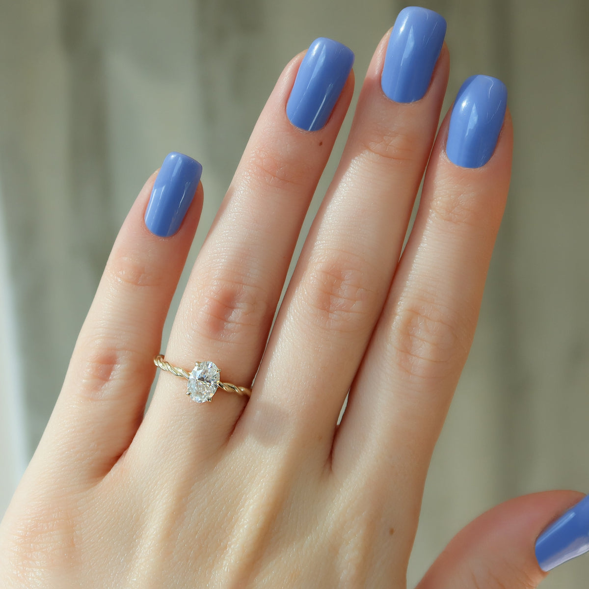 Oval cut CVD diamond engagement ring with hidden halo in platinum setting