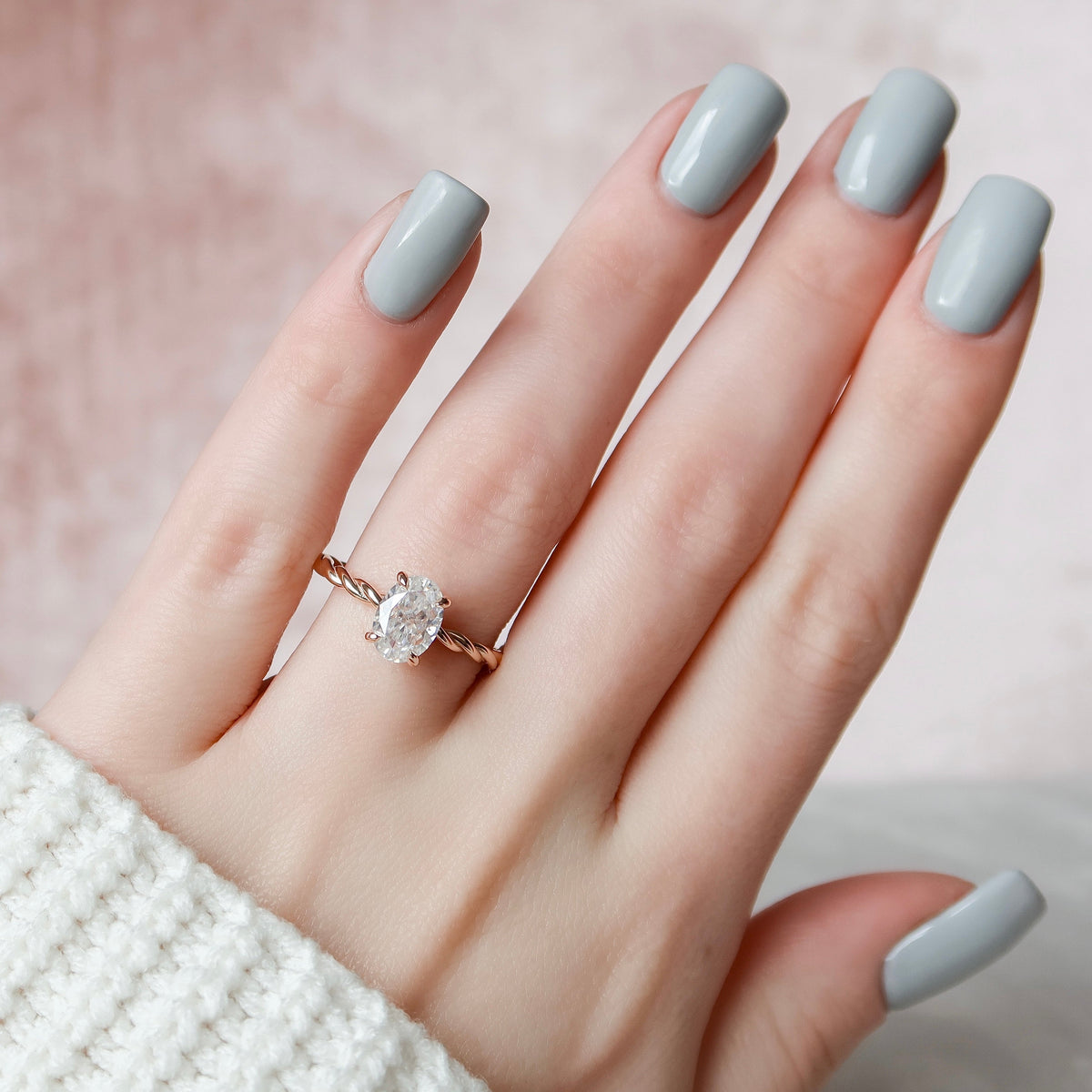 Oval cut CVD diamond engagement ring with hidden halo in platinum setting