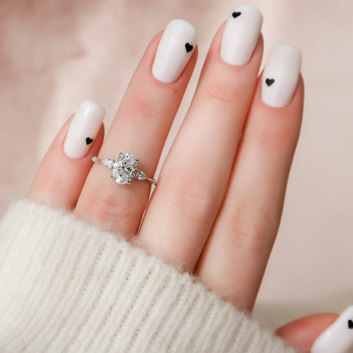 Oval cut CVD diamond hidden halo engagement ring in white gold setting
