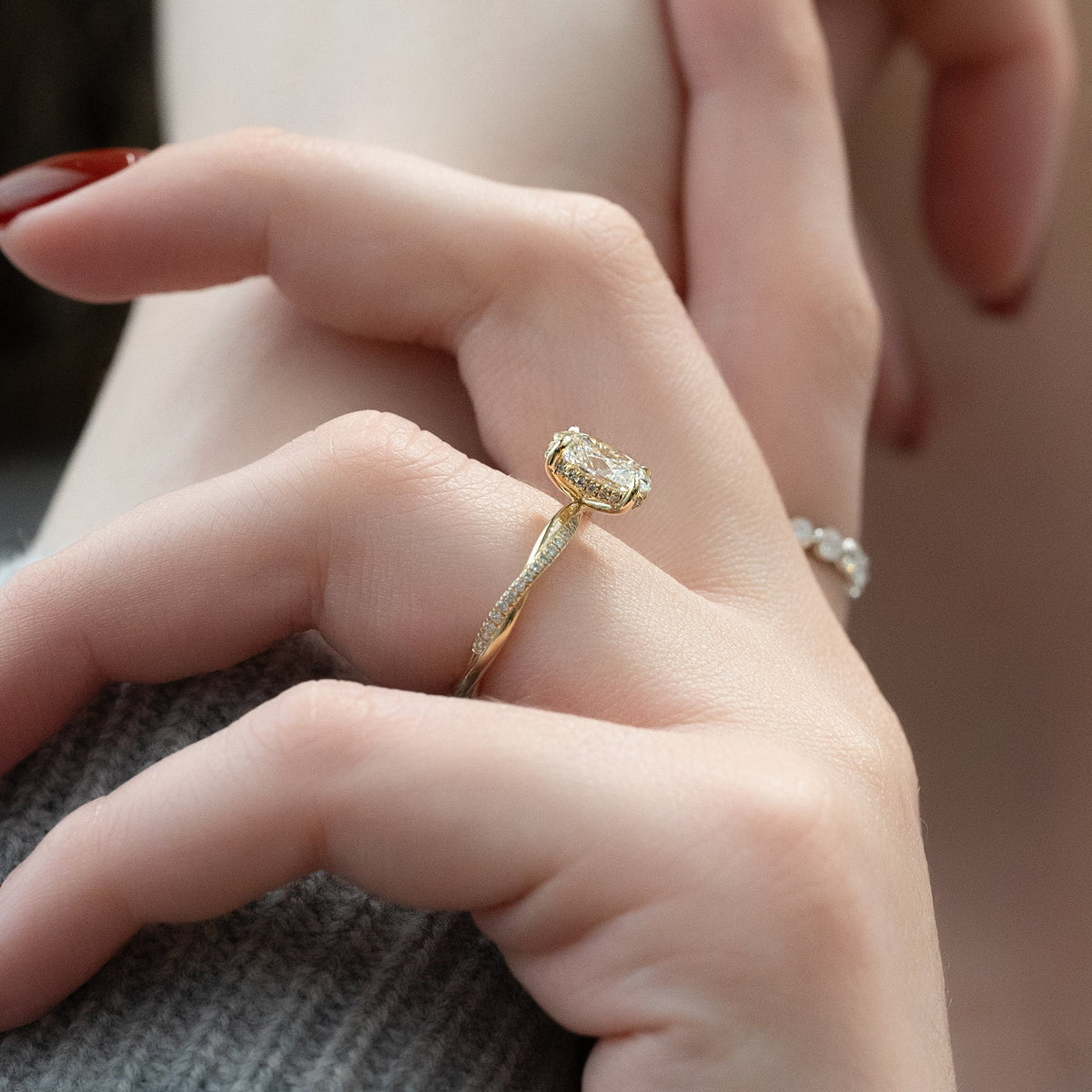 Oval cut CVD diamond engagement ring with elegant twisted band in platinum
