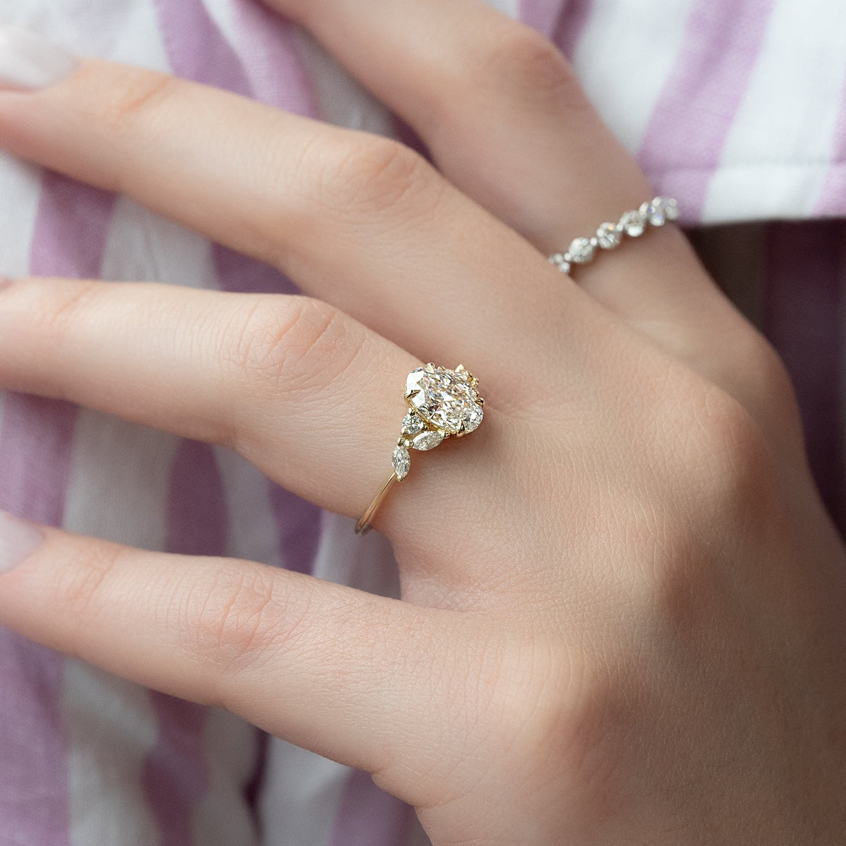 Oval cut CVD diamond cluster engagement ring in white gold setting