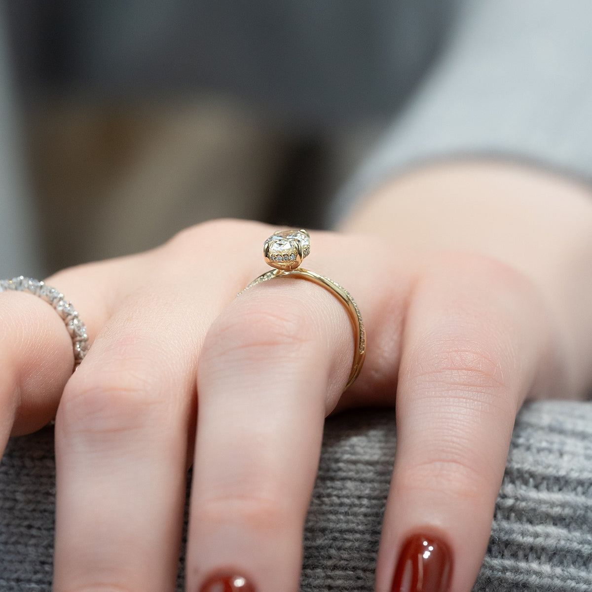 Oval cut CVD diamond engagement ring with elegant twisted band in platinum