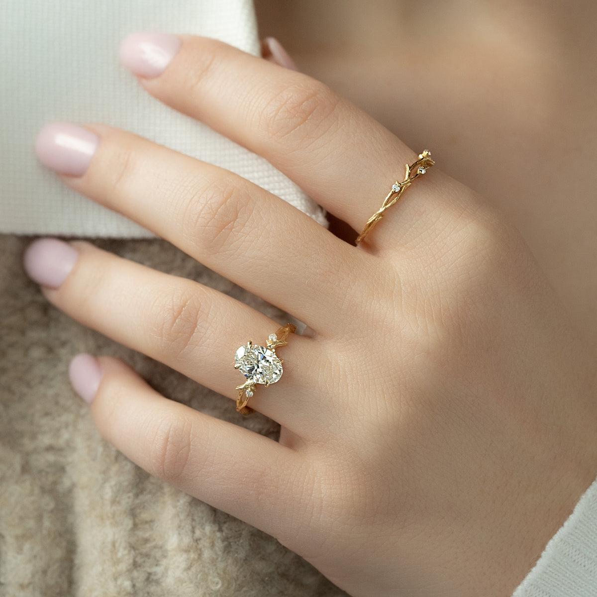 Oval cut CVD diamond engagement ring with twig-style band in white gold