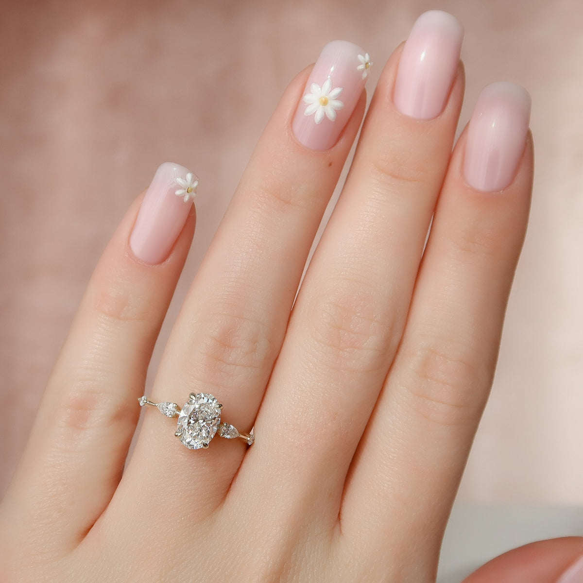 Oval cut CVD diamond hidden halo engagement ring in white gold setting