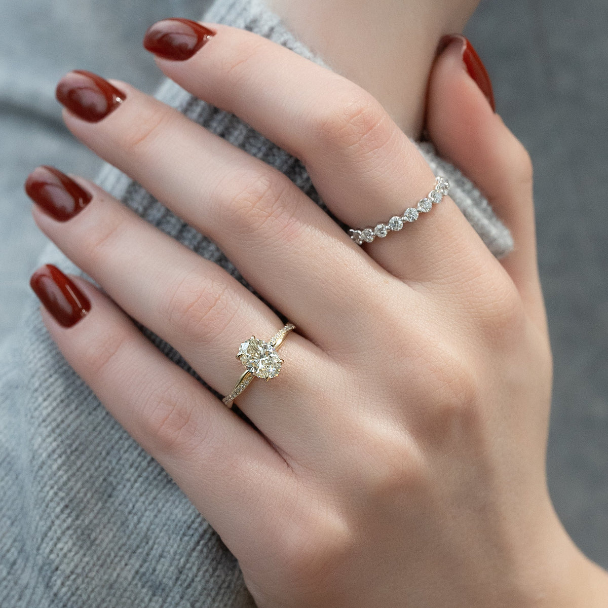 Oval cut CVD diamond engagement ring with elegant twisted band in platinum