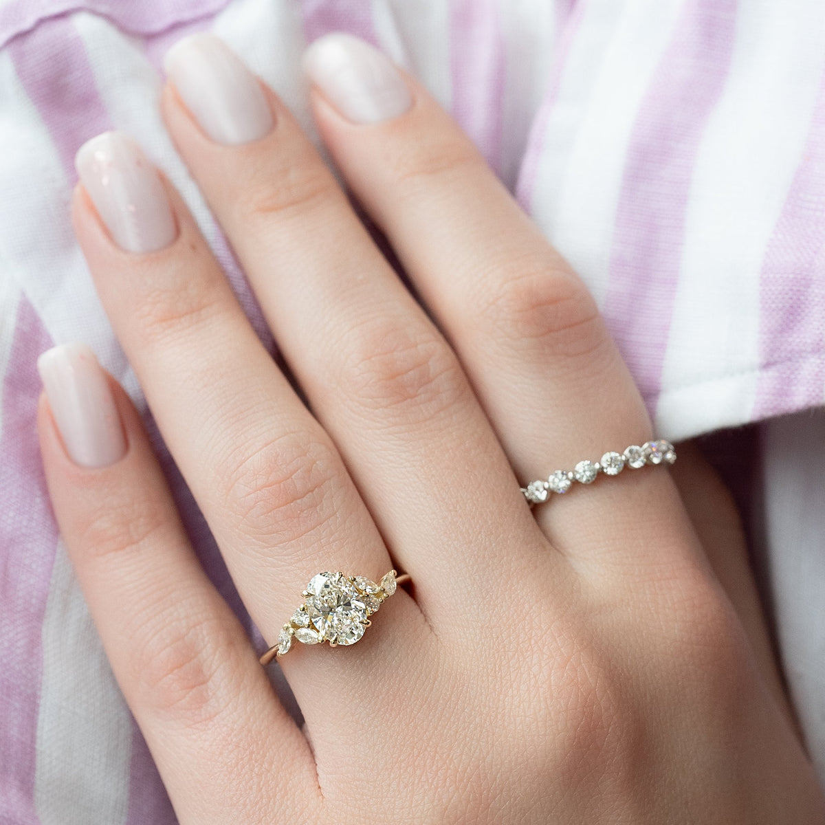 Oval cut CVD diamond cluster engagement ring in white gold setting