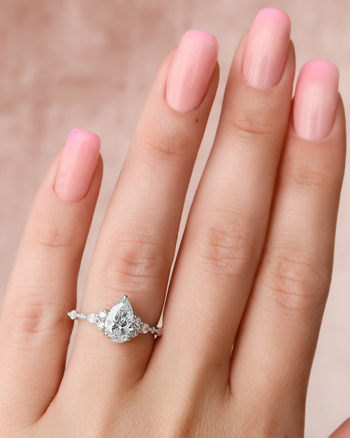 Pear cut CVD diamond cluster engagement ring in white gold setting