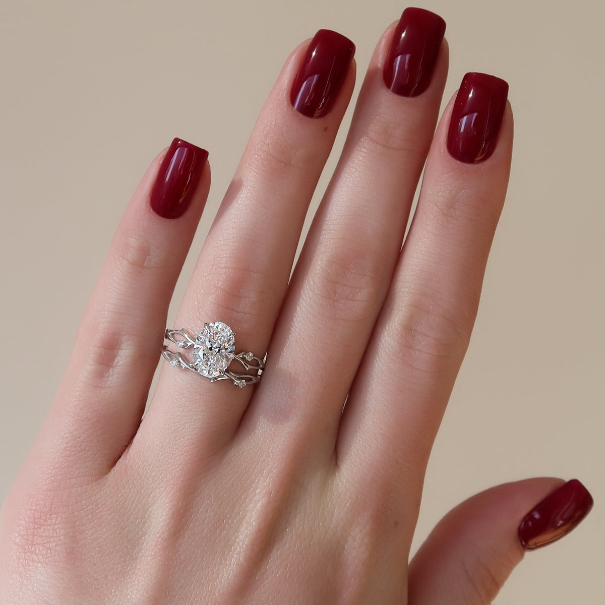 Oval cut CVD diamond engagement ring with twig-style band in white gold