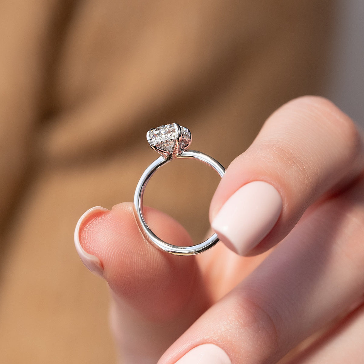 Oval cut CVD diamond hidden halo engagement ring with delicate band in white gold