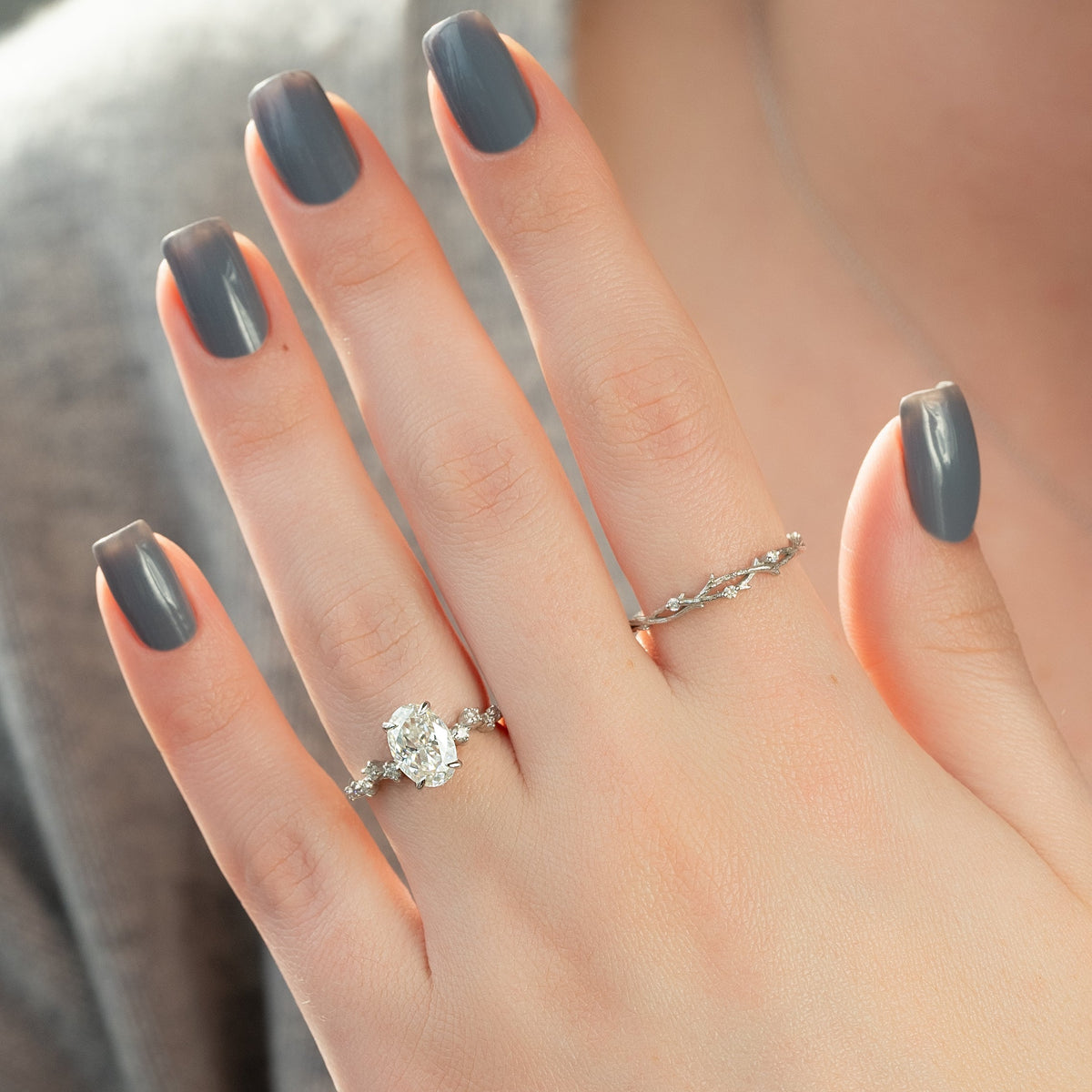 Oval cut CVD diamond engagement ring with hidden halo and pave diamond band in white gold