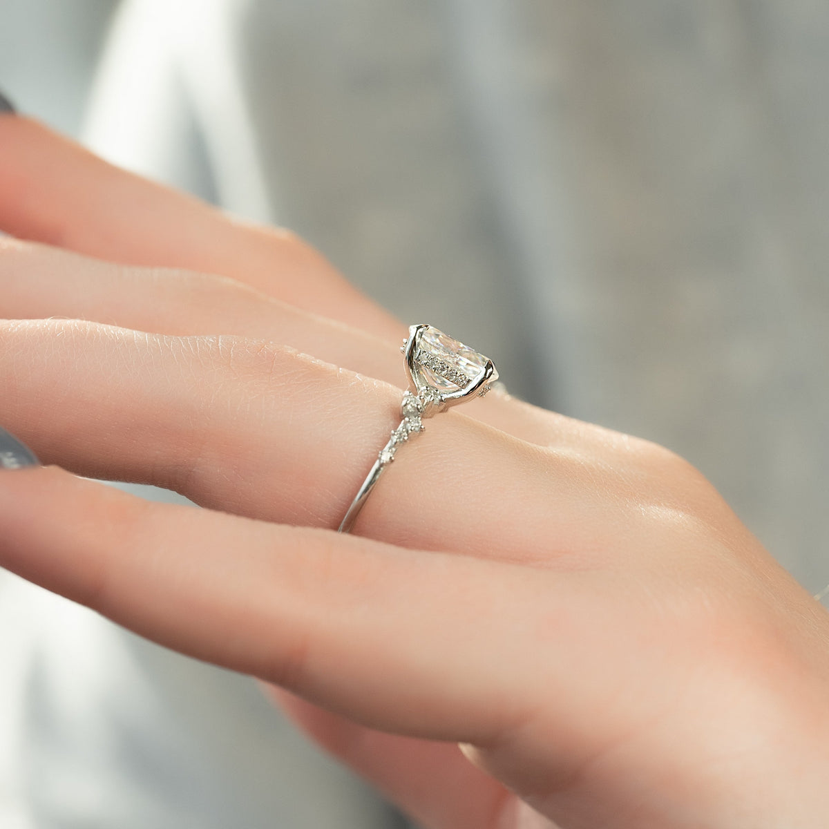 Oval cut CVD diamond engagement ring with hidden halo and pave diamond band in white gold
