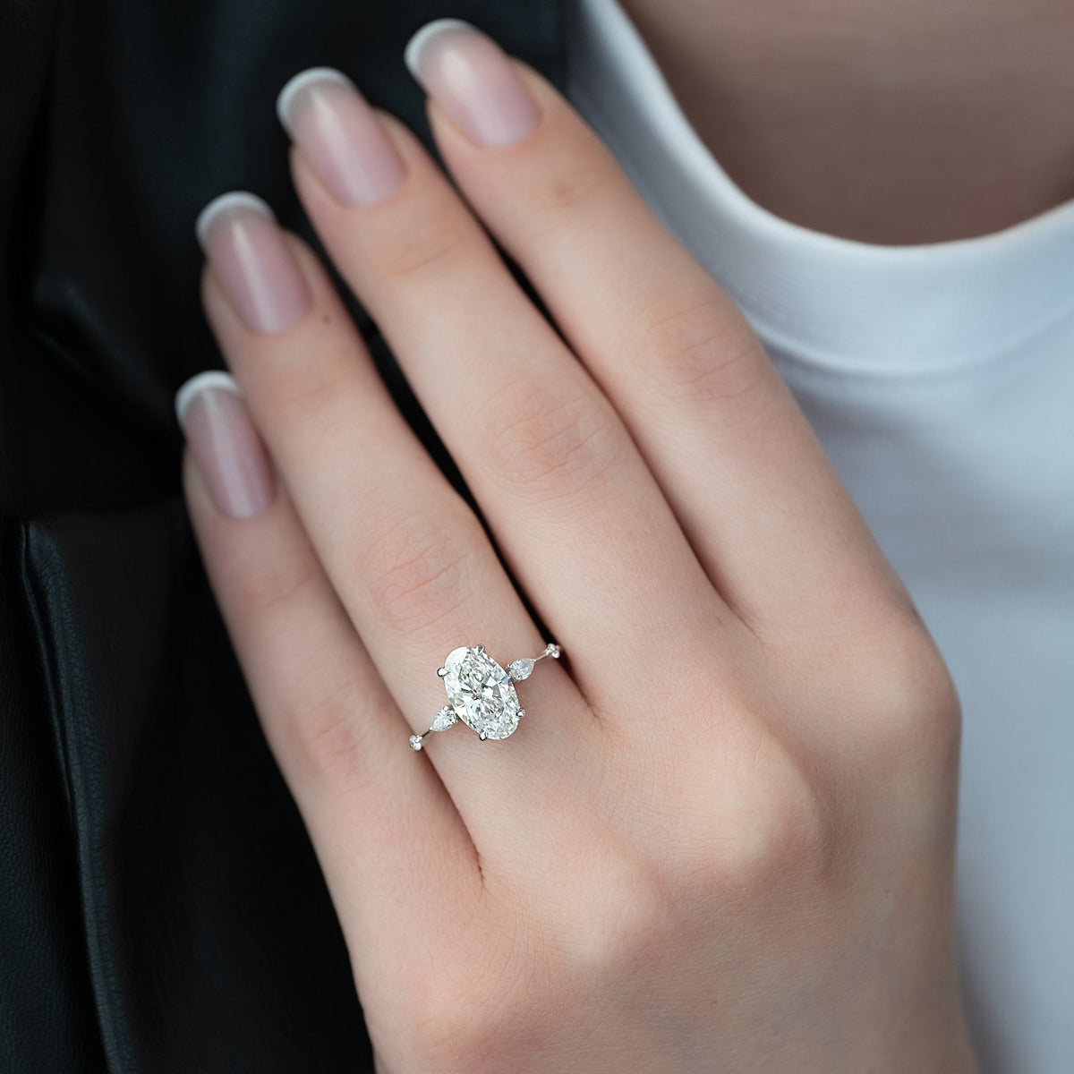 Oval cut CVD diamond hidden halo engagement ring in white gold setting