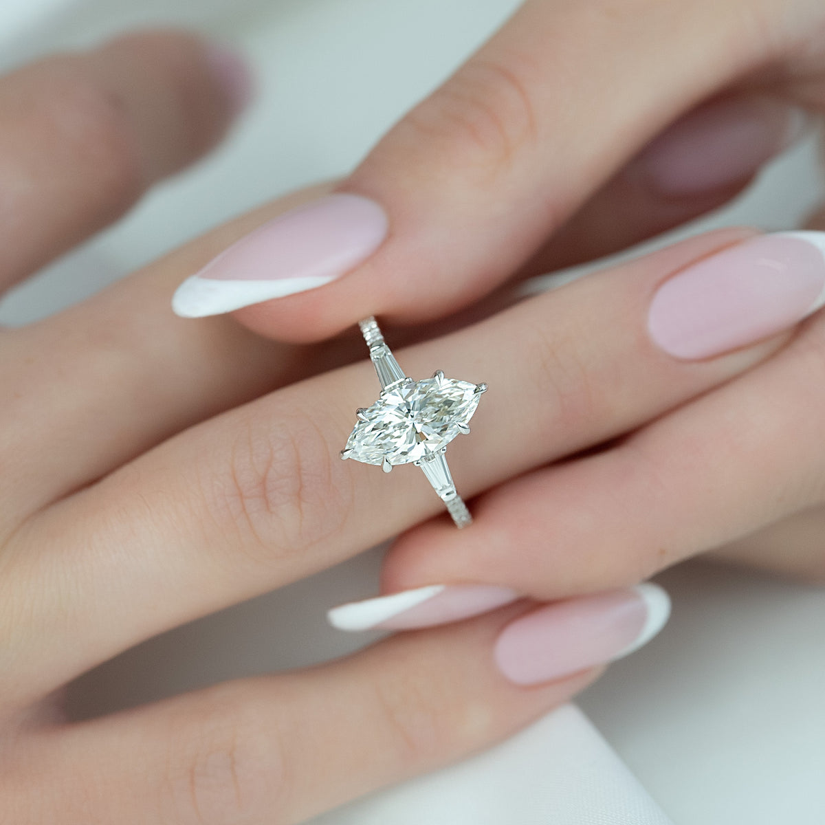 Marquise cut CVD diamond three stone engagement ring with pave band in white gold