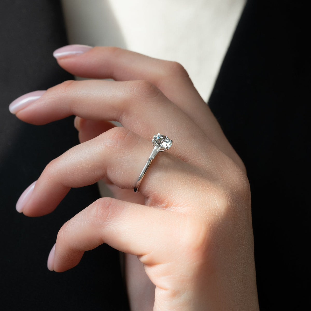 Round cut CVD diamond three stone engagement ring in platinum band
