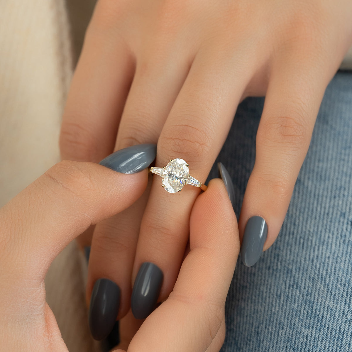 Oval cut CVD diamond three-stone engagement ring in white gold setting