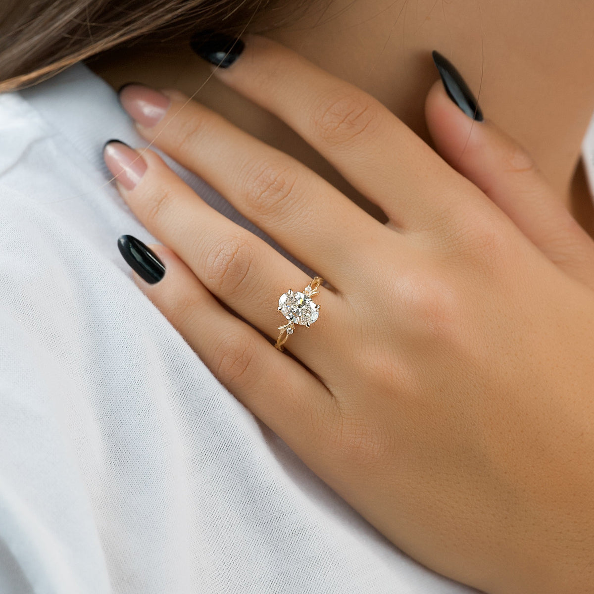 Oval cut CVD diamond engagement ring with twig-style band in white gold