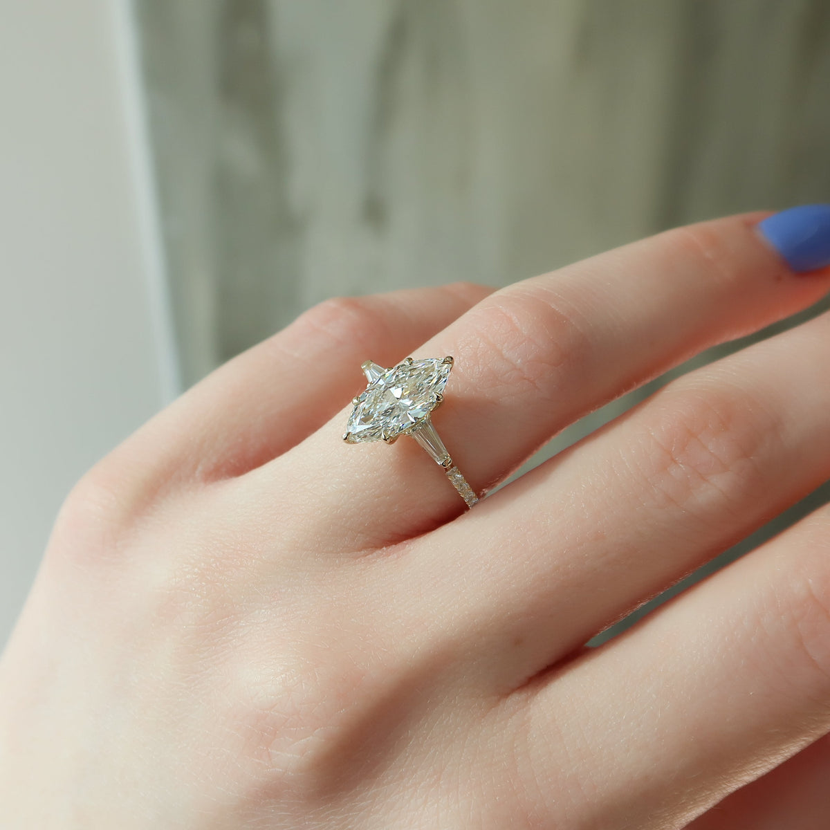 Marquise cut CVD diamond three stone engagement ring with pave band in white gold