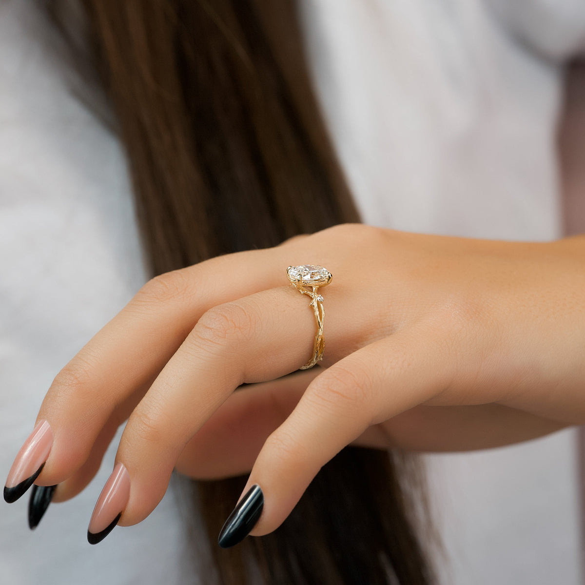 Oval cut CVD diamond engagement ring with twig-style band in white gold
