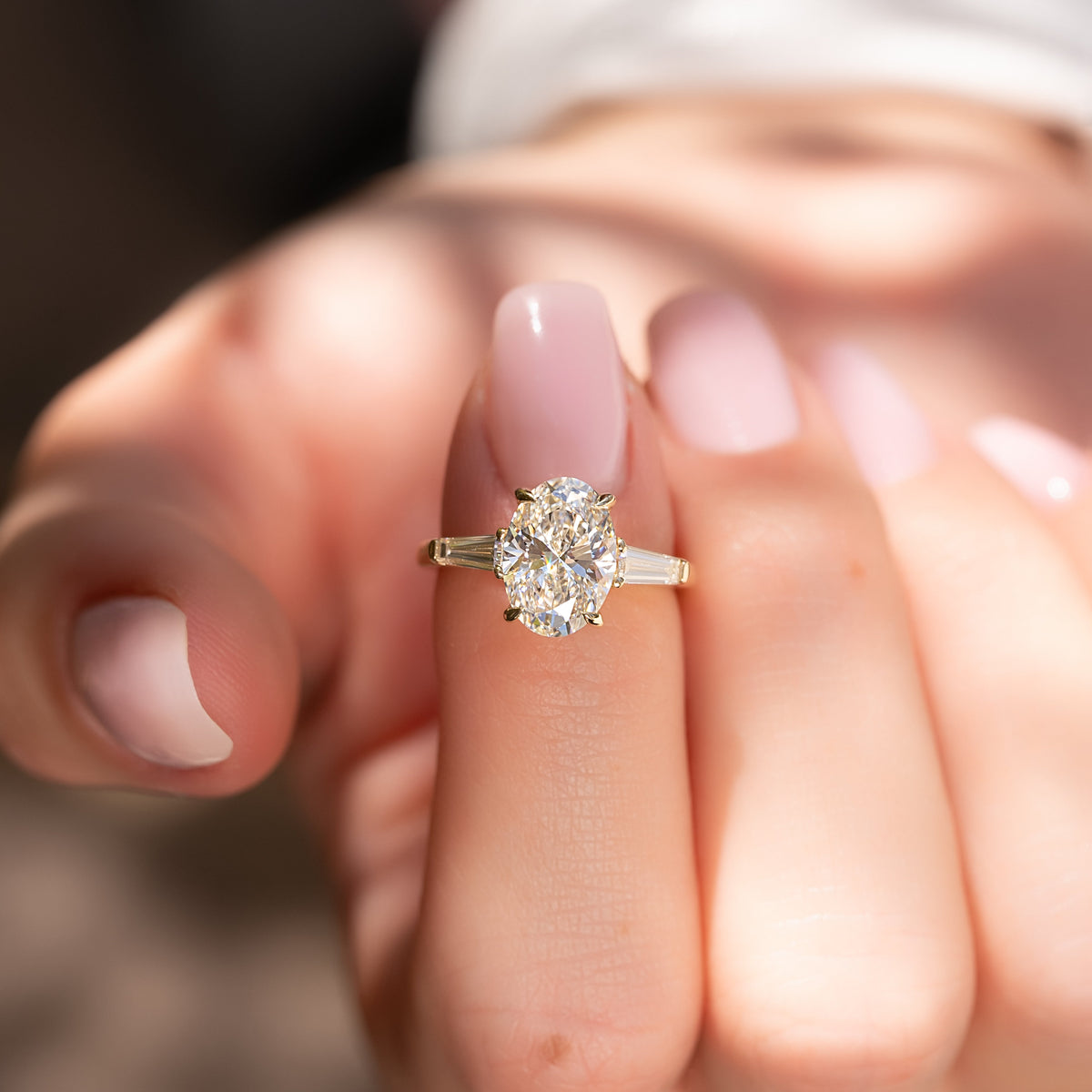 Oval cut CVD diamond three-stone engagement ring in white gold setting