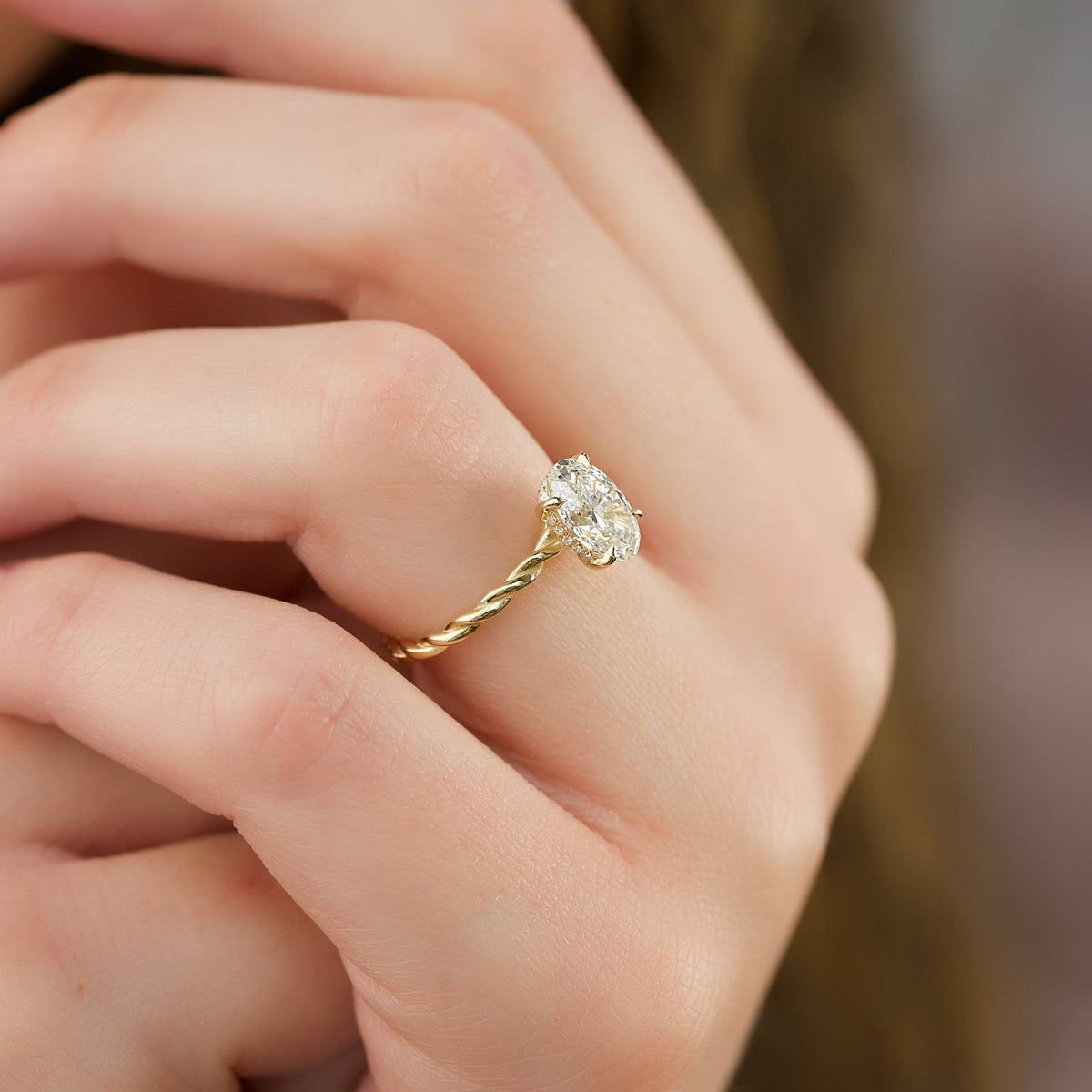 Oval cut CVD diamond engagement ring with hidden halo in platinum setting