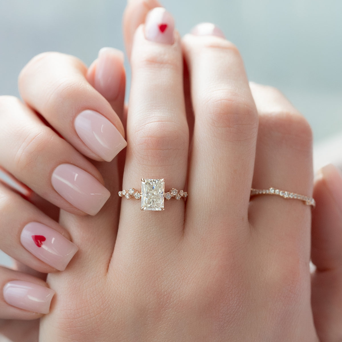 Radiant cut CVD diamond engagement ring with hidden halo and clustered diamond detailing in white gold