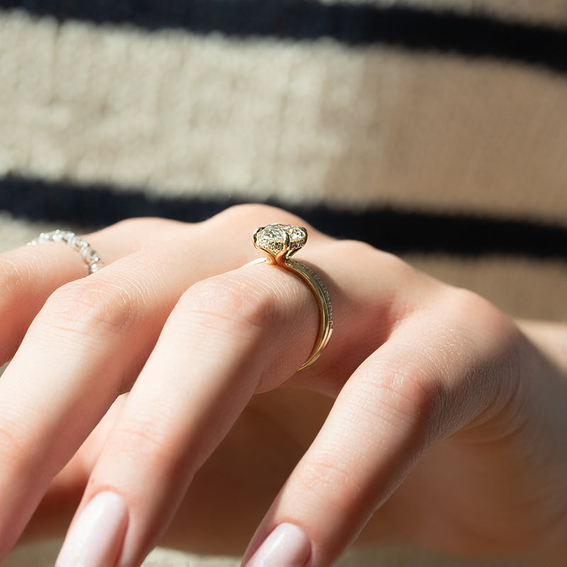 Oval cut CVD diamond hidden halo engagement ring with delicate band in white gold