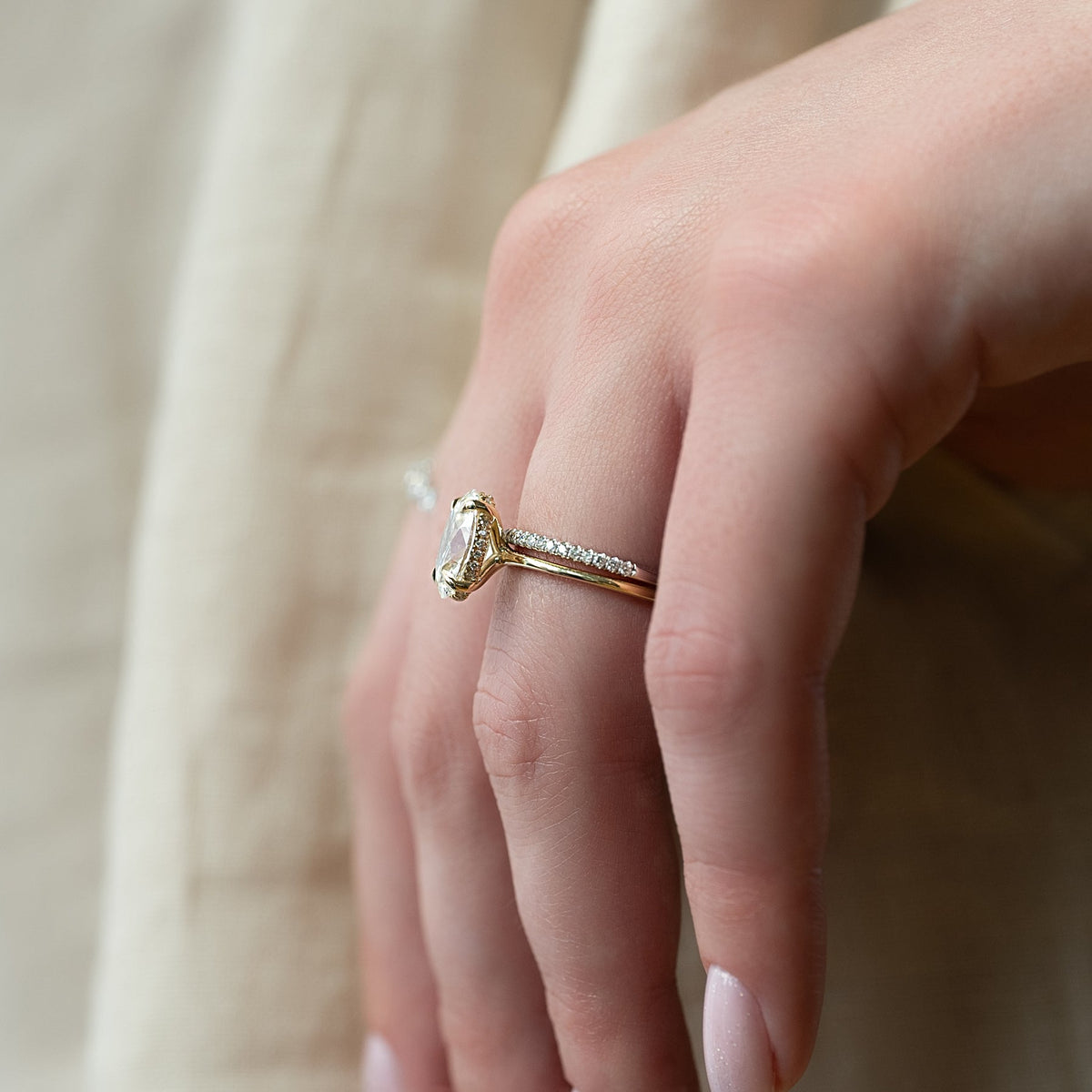 Oval cut CVD diamond hidden halo engagement ring with delicate band in white gold