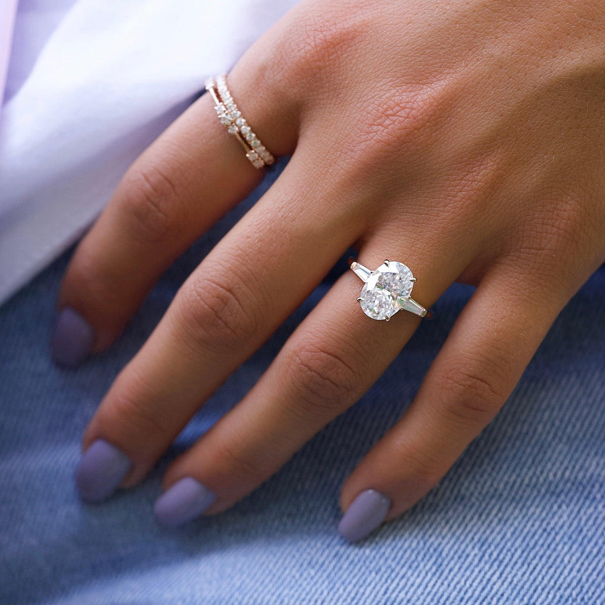 Oval cut CVD diamond three-stone engagement ring in white gold setting
