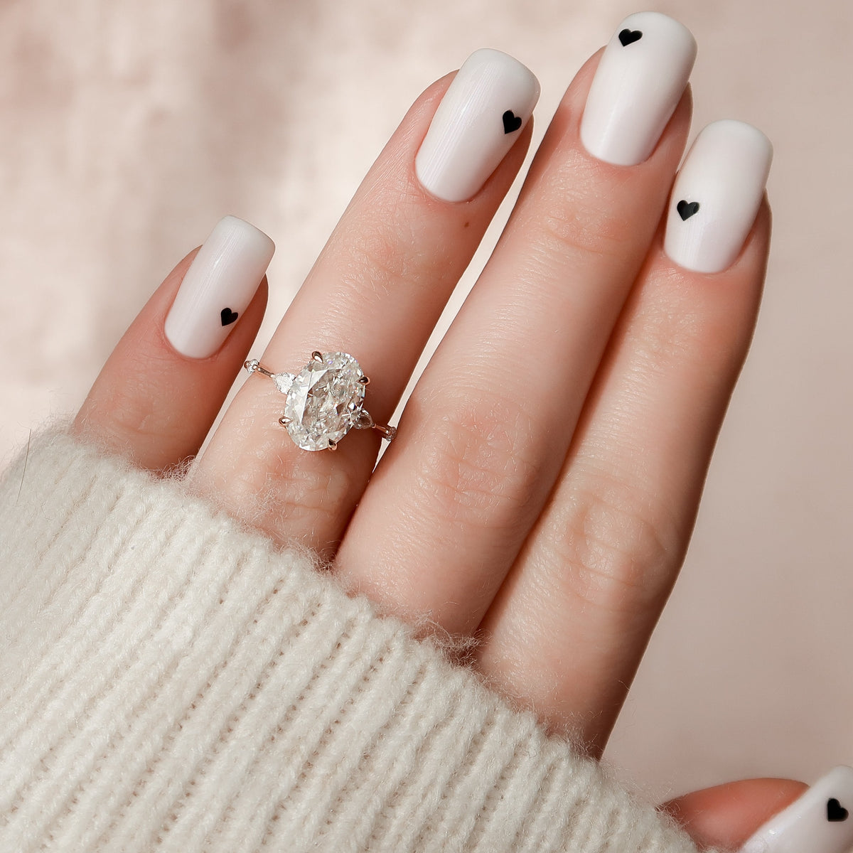 Oval cut CVD diamond hidden halo engagement ring in white gold setting